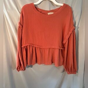 Elegant Rust Blouse with Ruffled Hem